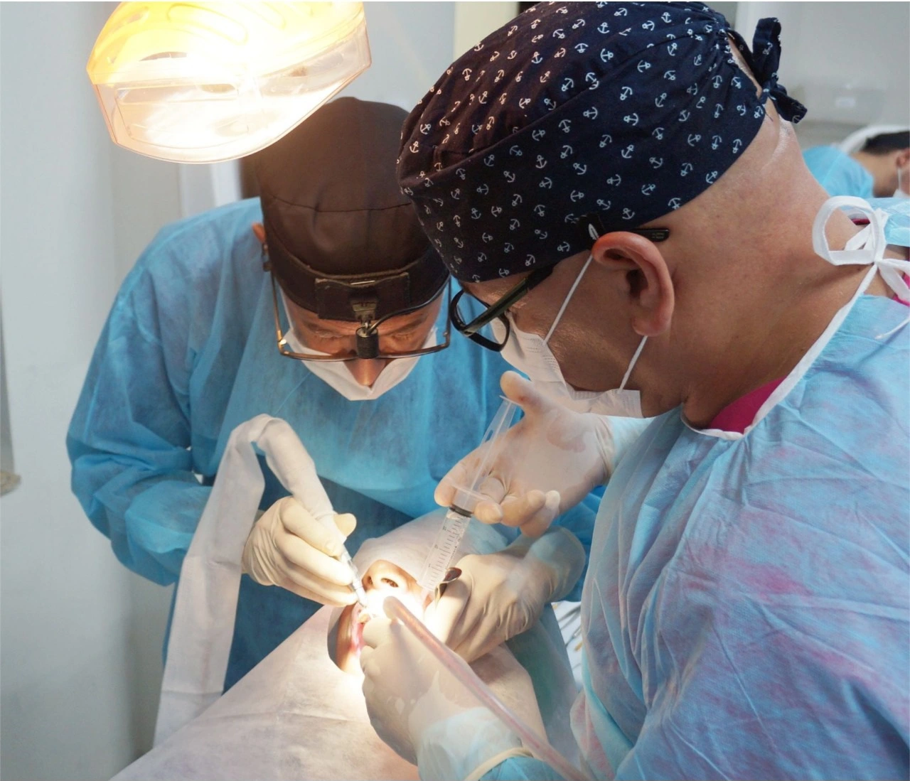 Dentists performing implant surgery during training